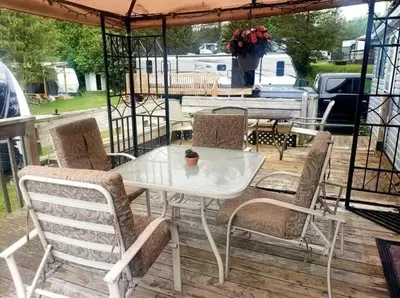 a white table and chairs on a deck at Westlake Dunes View Beach-FREE Pontoon Boat Rental in West Lake