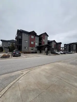 an empty street with buildings in the background at 3 Bdrm Blue Mountain Condo in Collingwood