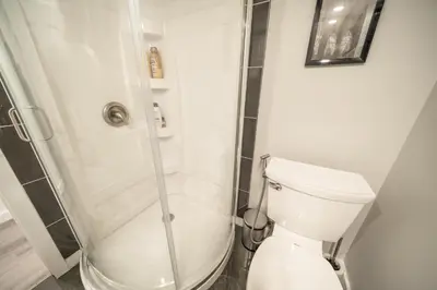 a bathroom with a shower and a toilet at Luxurious 2 Bed Apartment in Downtown Cambridge in Cambridge