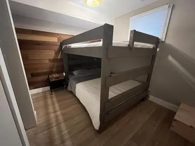 a small room with two bunk beds in it at The Luxe Lodge in Algonquin Highlands