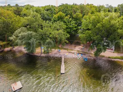 an aerial view of a body of water with a pier at The Meadowlark - 115 Butternut in Cherry Valley