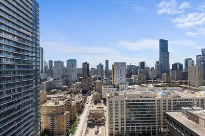 an aerial view of a city with tall buildings at Downtown 2 bedroom Condo with Private Balcony in Toronto