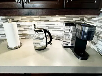 a kitchen counter with a coffee maker and a blender at 3500 SqFt - Modern and Comfort - 4 BDRM Getaway - Relax - Unwind - Explore - Near Airport & Toronto Downtown in Brampton