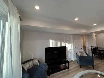 a living room with a couch and a television at One-Bedroom Unit at VISTA HILL in Waterloo