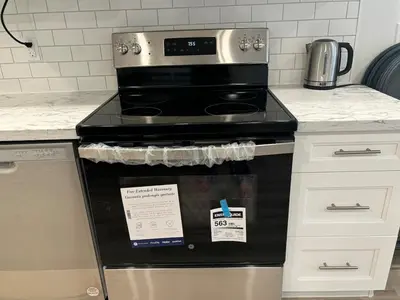 a stove in a kitchen with a sign on it at One-Bedroom Unit at VISTA HILL in Waterloo