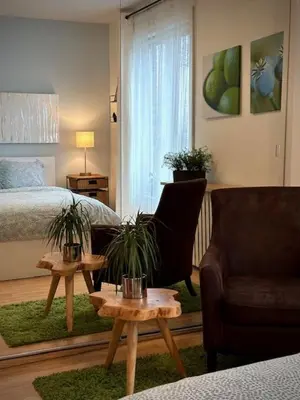 a living room with a bed and a couch and a table at Girls Night Out in Toronto