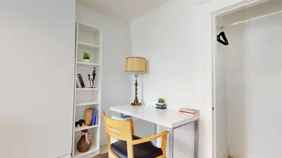 a white desk with a lamp and a chair at Comfortable & Spacious Private Room with Ensuite in Corso Italia in Toronto