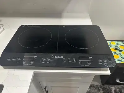 a stove top oven sitting on top of a counter at Luxury Basement-Private Bdr & Bathroom with free parking In Toronto in Toronto