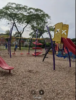 a playground with a bunch of slides and swings at Midtown Toronto suite in Toronto