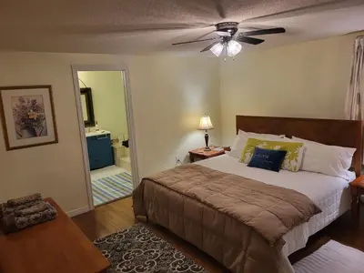 a bedroom with a bed and a ceiling fan at 308 Delancey in Hamilton