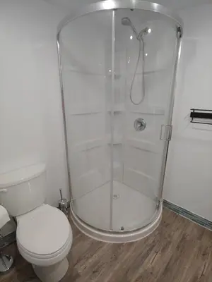 a bathroom with a shower and a toilet at Two bedroom on Toronto Greenhills in Toronto