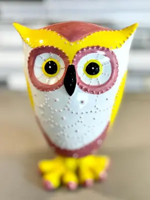 a toy owl figurine withooky eyes and legs at Connected Comfort - 7BR Family Retreat - Near Pearson Airport & Toronto Downtown in Brampton