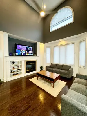a living room with a couch and a coffee table at Connected Comfort - 7BR Family Retreat - Near Pearson Airport & Toronto Downtown in Brampton