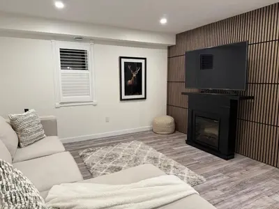 a living room with a fireplace and a tv at Modern & Stylish 2BR Apartment 658 in Peterborough