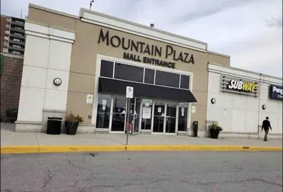 a mountain plaza mall entrance on a city street at Hamilton Chic Retreat - Cozy Winter Getaway in Hamilton