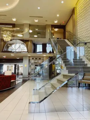 a lobby with a staircase in a building at Urban Oasis - Modern 1 bedroom w pool access free parking in Toronto
