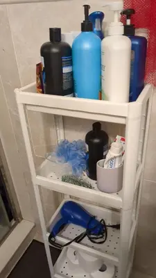 a shelf with bottles and other items on it at Two Separate Units in Richmond Hill