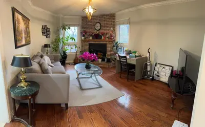 a living room with a couch and a table at Large private room in Mississauga
