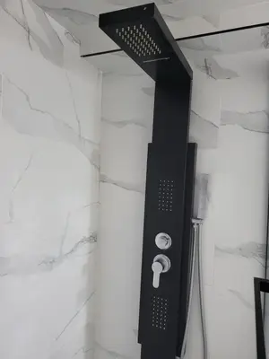 a shower in a bathroom with a black object at Home of Sweet Dream in Whitby