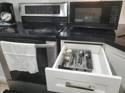 a kitchen with a stove and a microwave at Home of Sweet Dream in Whitby