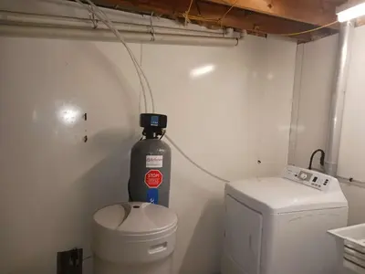 a bathroom with a fire extinguisher next to a toilet at Smart Budget Friendly Room-Near Airport, Groceries,College in Kitchener
