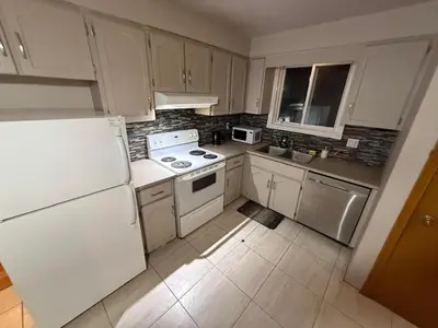 a kitchen with white appliances and a white refrigerator at UPTOWN WATERLOO-KWC ROOM-Best Location,Lowest Prices in Waterloo