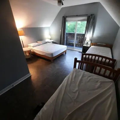 a bedroom with two beds and a window at Cottage by the beach in Wasaga Beach