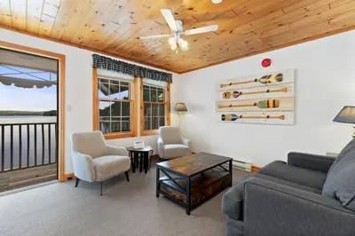 a living room with a couch and chairs at Port Cunnington Lodge in Dwight