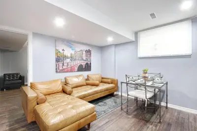 a living room with a couch and a table at Deluxe Apartment in Caledon