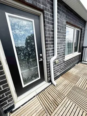 a front door of a house with a balcony at Modern Private Room Private Bathroom with King Bed with TV and Optional Balcony 10 minutes to Rogers Stadium Midtown Downtown Toronto in Toronto