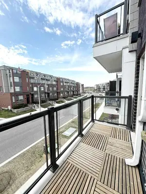 an apartment balcony with a view of a street at Modern Private Room Private Bathroom with King Bed with TV and Optional Balcony 10 minutes to Rogers Stadium Midtown Downtown Toronto in Toronto
