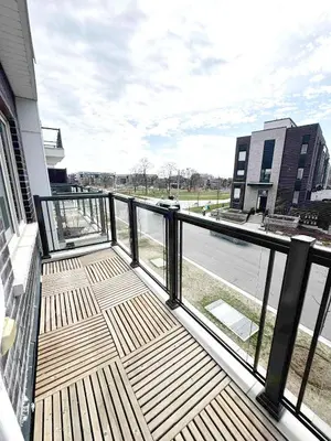 a balcony with a view of a street at Modern Private Room Private Bathroom with King Bed with TV and Optional Balcony 10 minutes to Rogers Stadium Midtown Downtown Toronto in Toronto