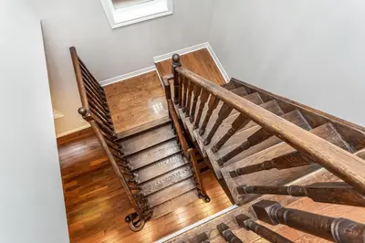 a staircase in a home with wooden floors at Decor Dreams in Stayner