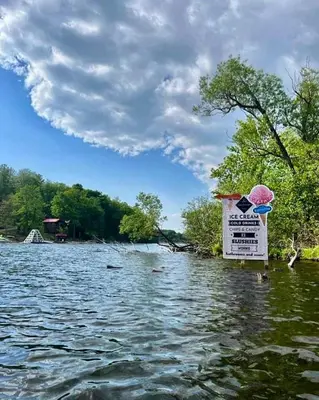 a sign in the middle of a body of water at Wildwood Bunkies in Bailieboro