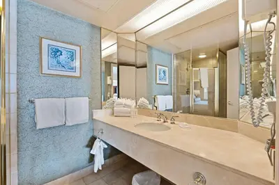 a bathroom with a sink and a large mirror at Peaceful Escape King Bed and Outdoor Activities in Edgar