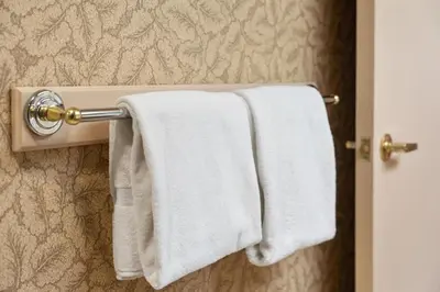 two white towels hanging on a towel rack in a bathroom at Luxury Resort Stay with Pool Jacuzzi and Balcony in Edgar
