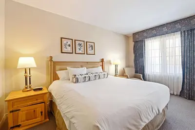 a bedroom with a large white bed and a window at Luxury Resort Stay with Pool Jacuzzi and Balcony in Edgar