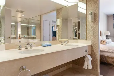 a bathroom with two sinks and a large mirror at Resort Style with Balcony Hot Tub and Full Kitchen in Edgar