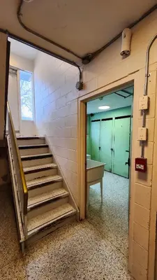 a staircase in a room with a door and a sink at ENTIRE 1 BEDROOM APARTMENT by UW RESEARCH PARK - PS1 in Waterloo