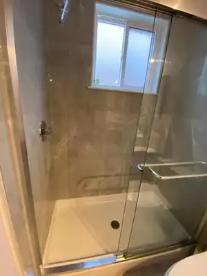 a shower with a glass door in a bathroom at ENTIRE 1 BEDROOM APARTMENT by UW RESEARCH PARK - PS1 in Waterloo