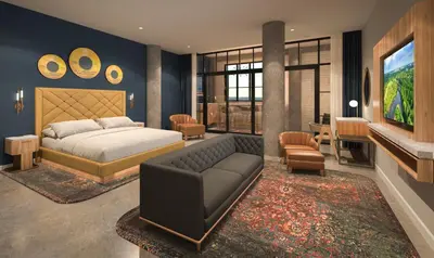 a bedroom with a bed and a living room at Hard Rock Hotel London Ontario in London