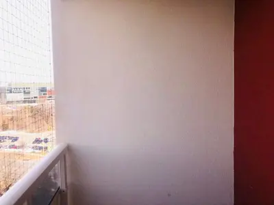 a room with a white wall and a window at Earth Tone Suites in Pickering