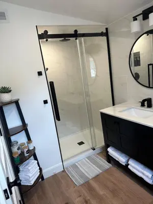 a bathroom with a shower and a sink at Garden Suite with Pool and Sauna in Brampton