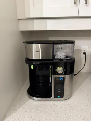 a coffee maker sitting on a counter in a kitchen at Cozy 3 Bedroom Townhome Hyde Park Mall & Western University in London