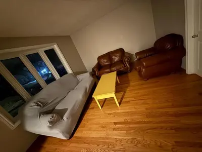 a living room with a couch and a table at Affordable Family Room for 4 People-24Hrs Checkin-Next To Downtown,Airport in Kitchener