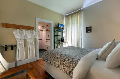 a bedroom with a bed and a window at The Breadalbane Inn in Fergus