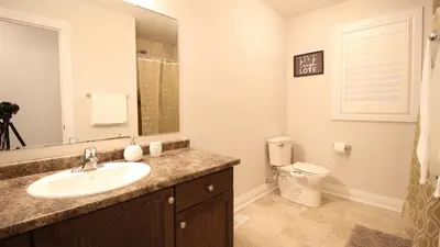 a bathroom with a sink and a toilet at Beautiful House Near Grand River & Kiwanis Park in Kitchener