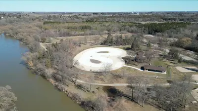 an aerial view of a swimming pool next to a river at Beautiful House Near Grand River & Kiwanis Park in Kitchener
