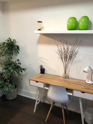 a desk with a chair and two green apples at Chic Toronto Blue Jays Getaway in Toronto