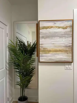 a plant in a pot next to a painting on a wall at French Style Mansion In Prestigious Angus Glen Markham in Markham